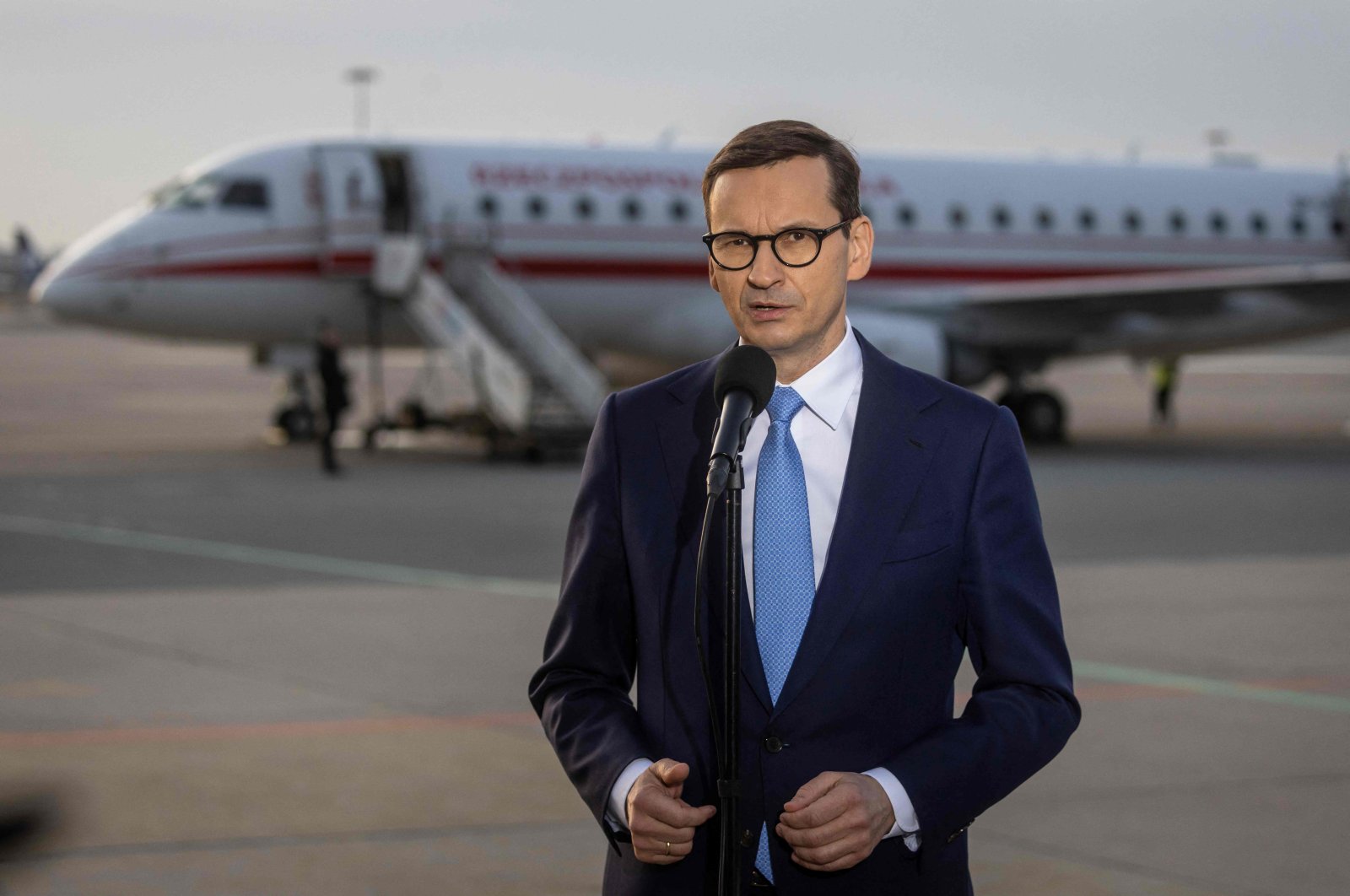 Polish Prime Minister Mateusz Morawiecki speaks to journalists at Warsaw Airport before leaving for Brussels for an emergency EU summit on the Russian invasion of Ukraine, Poland, Feb. 24, 2022. (AFP Photo)