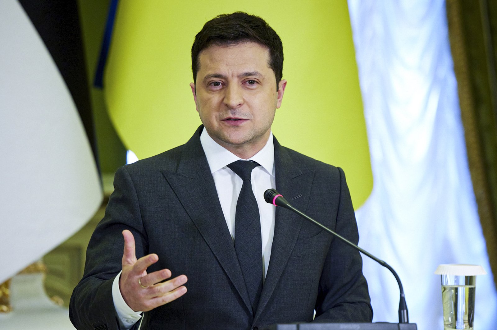 In this photo provided by the Ukrainian Presidential Press Office, Ukrainian President Volodymyr Zelenskyy gestures during a joint news conference with Estonian President Alar Karis following their talks in Kyiv, Ukraine, Tuesday, Feb. 22, 2022. (AP Photo)