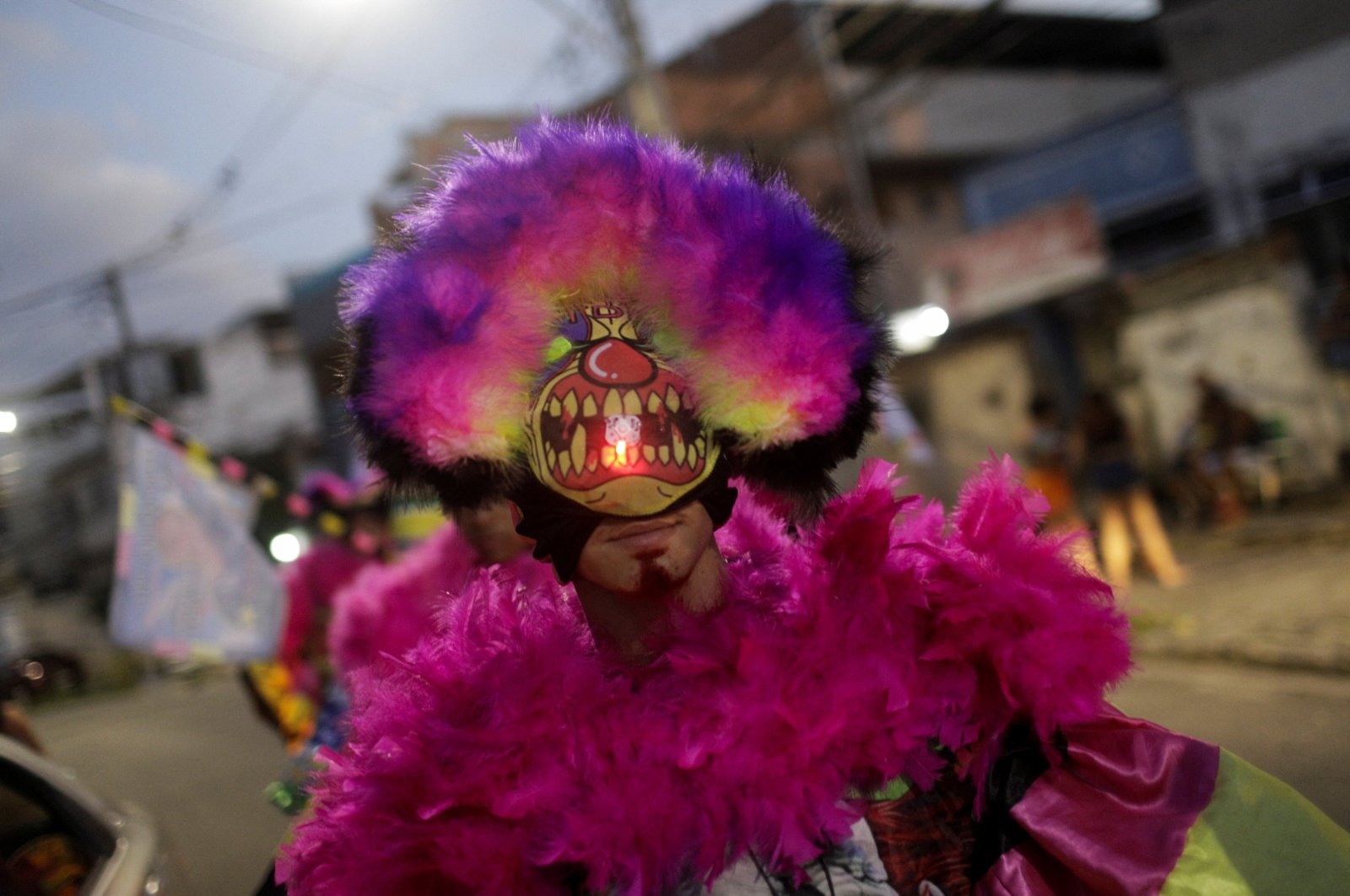 "Bate-bola" (slam the ball) revelers perform during the traditional carnival festivity in a suburb, despite Carnival celebrations being postponed to April due to the coronavirus outbreak in Rio de Janeiro, Brazil, Feb. 25, 2022. (Reuters Photo)