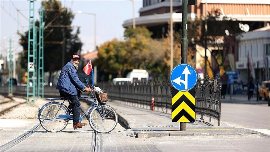 A man rides a bicycle across a tramline in Konya, central Turkey, Oct. 22, 2021. (AA Photo)