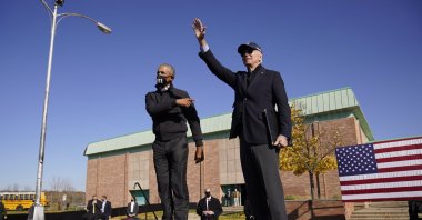 Then-U.S. Democratic presidential candidate former Vice President Joe Biden (R) and former U.S. President Barack Obama greet the crowd at a rally at Northwestern High School in Flint, Michigan, U.S., Oct. 31, 2020. (AP Photo)
