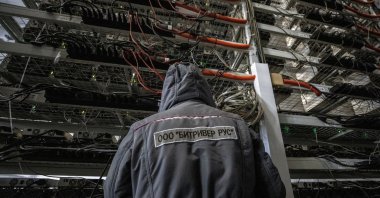 An employee works at the data centre of BitRiver company providing services for cryptocurrency mining in the city of Bratsk in Irkutsk Region, Russia, March 2, 2021. (Reuters Photo)