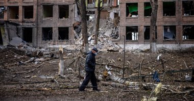 A man walks in front of a destroyed building after a Russian missile attack in the town of Vasylkiv, near Kyiv, Ukraine, Feb. 27, 2022. (AFP Photo)