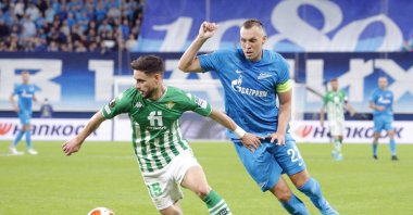 Zenit St. Petersburg's Artem Dzyuba in action with Real Betis' Alex Moreno in Gazprom Arena, Saint Petersburg, Russia, Feb.17, 2022. (Reuters File Photo)