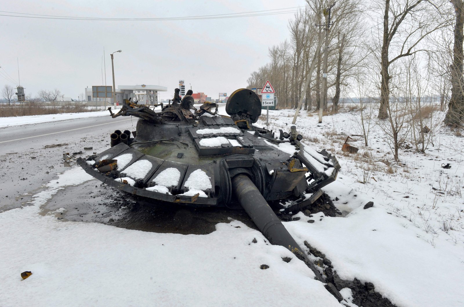 A fragment of a destroyed Russian tank is seen on the roadside on the outskirts of Kharkiv, Ukraine, Feb. 26, 2022. (AFP Photo)