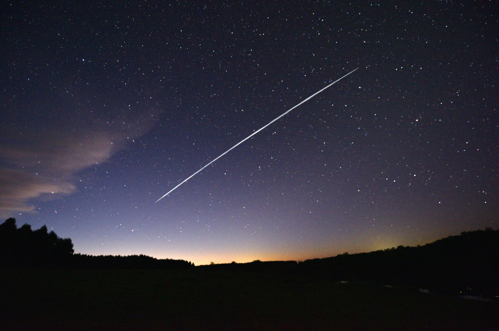 This long-exposure image shows a trail of a group of SpaceX&#039;s Starlink satellites passing over Uruguay as seen from the countryside some 185 km (115 miles) north of Montevideo, near Capilla del Sauce, Florida Department, Feb. 7, 2021. (AFP Photo)