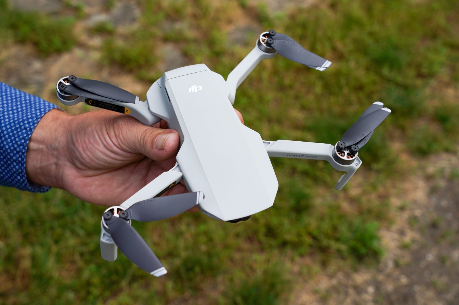 Ralph Werner of Quadrocopter Flight School holds a drone, a DJI Mavic Mini, in a park. (Reuters File Photo)
