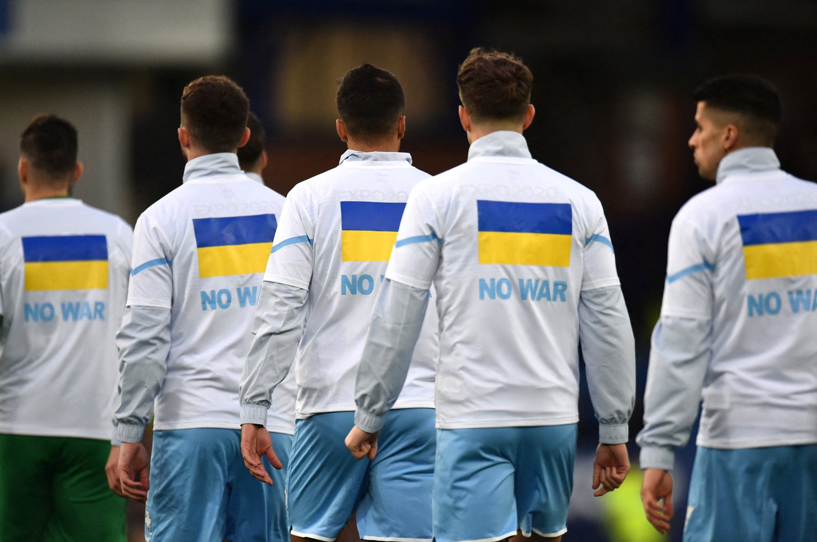 Manchester City players wear t-shirts in support of Ukraine before a Premier League match against Everton, Liverpool, Feb. 26, 2022. (Reuters Photo)