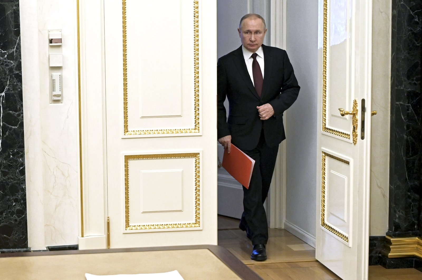 Russian President Vladimir Putin enters a hall to chair a Security Council meeting in Moscow, Russia, Friday, Feb. 25, 2022. (AP Photo)