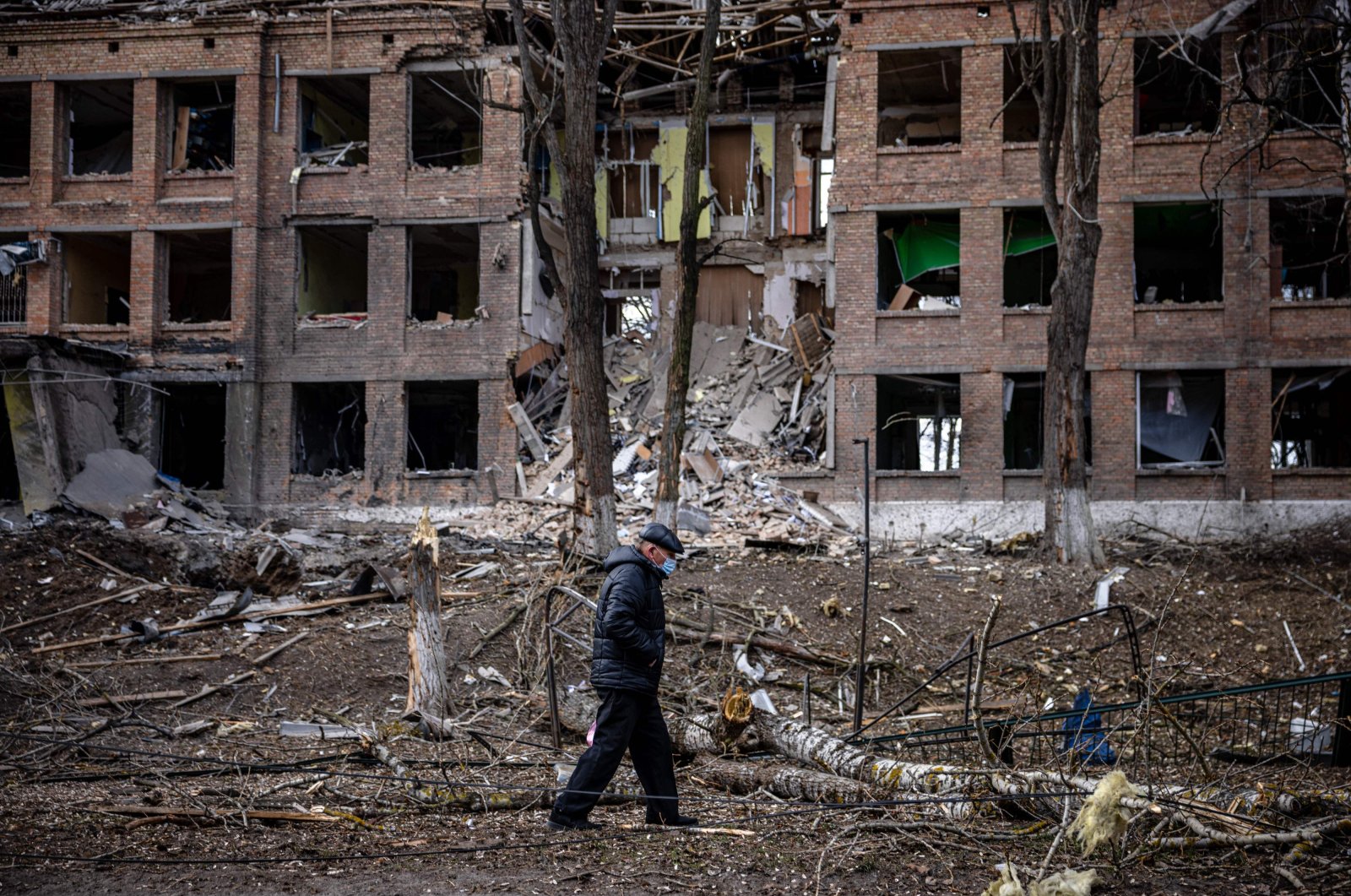A man walks in front of a destroyed building after a Russian missile attack in the town of Vasylkiv, near Kyiv, Ukraine, Feb. 27, 2022. (AFP Photo)