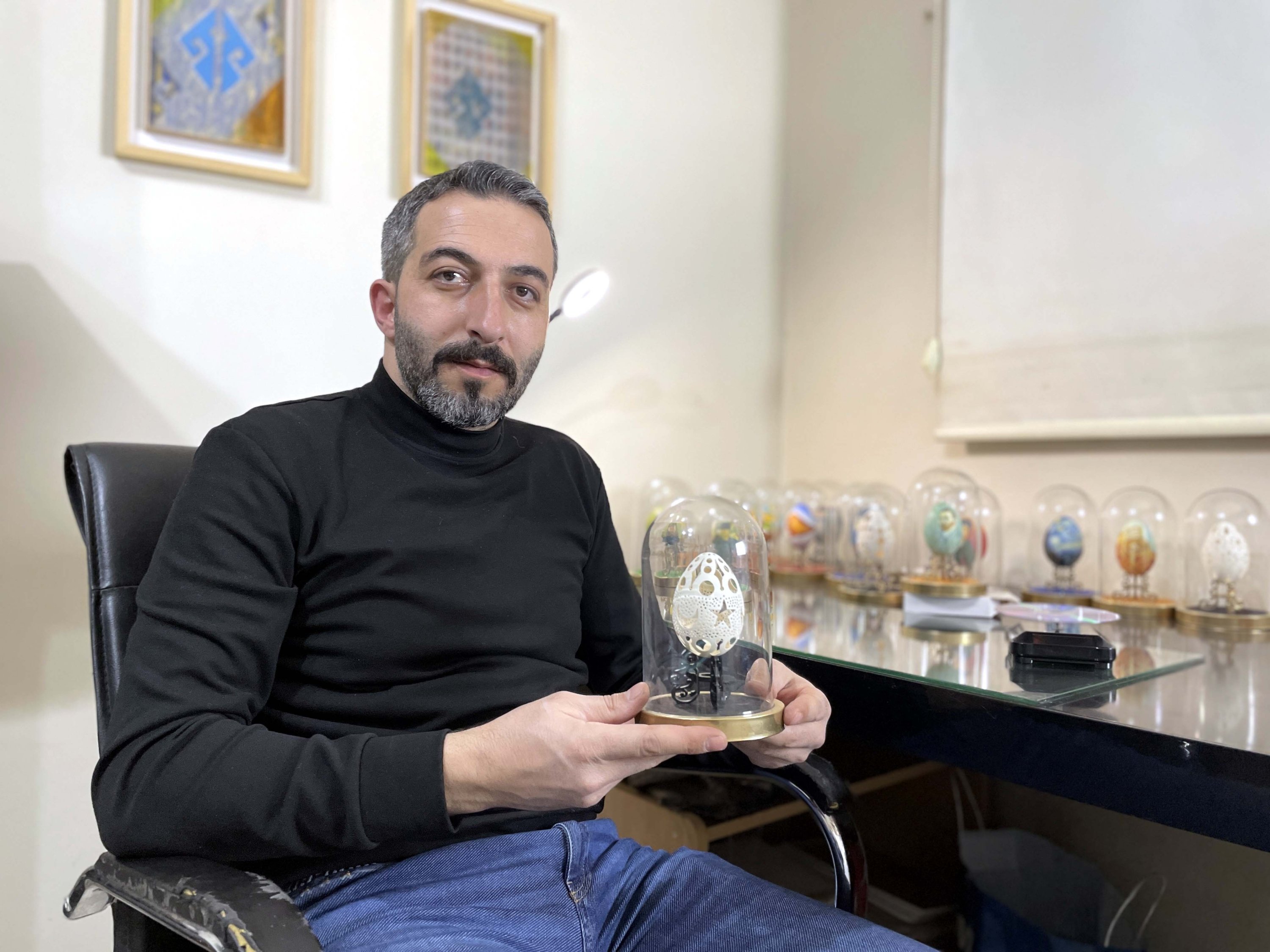 Zeynel Abidin Öztürk, a 40-year-old visual arts teacher who transforms goose eggs into art, with one of his pieces, Bayburt, northeastern Turkey, Feb. 28, 2022. (AA Photo)