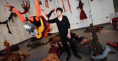 French artist Annette Messager with one of her fantastical installations, "Articulated-Disarticulated 2001-2002." (Reuters Photo)