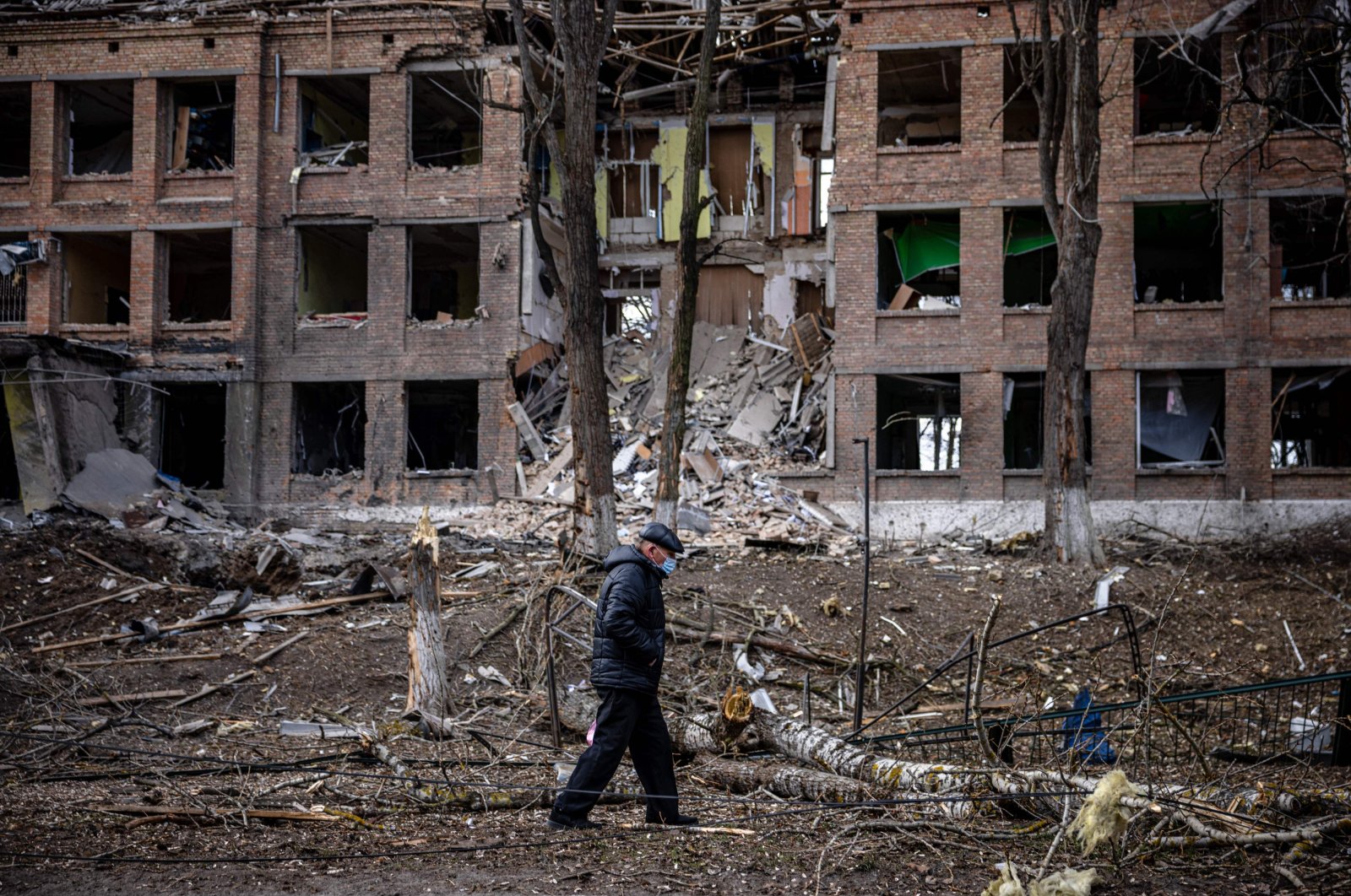 A man walks in front of a destroyed building after a Russian missile attack in the town of Vasylkiv, near Kyiv, Ukraine, Feb. 27, 2022. (AFP)