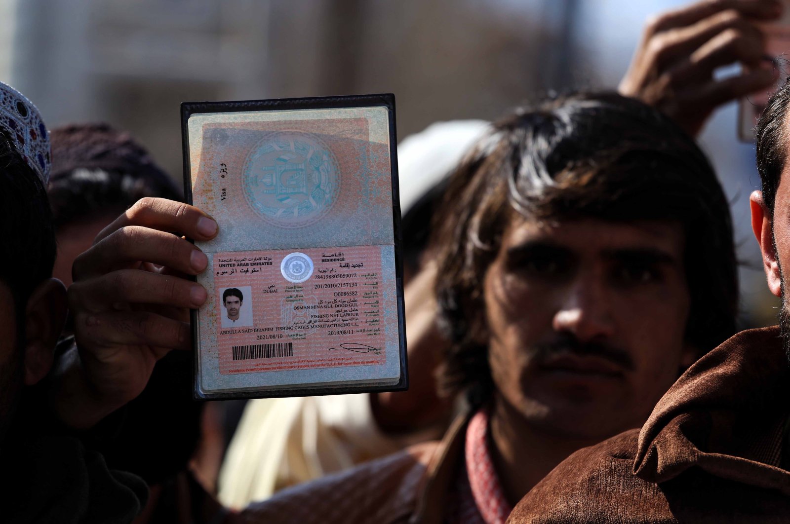 Laborers gather during a protest to demand the United Arab Emirates (UAE) start issuing visas, in Kabul, Afghanistan, Feb. 14, 2022. (EPA Photo)