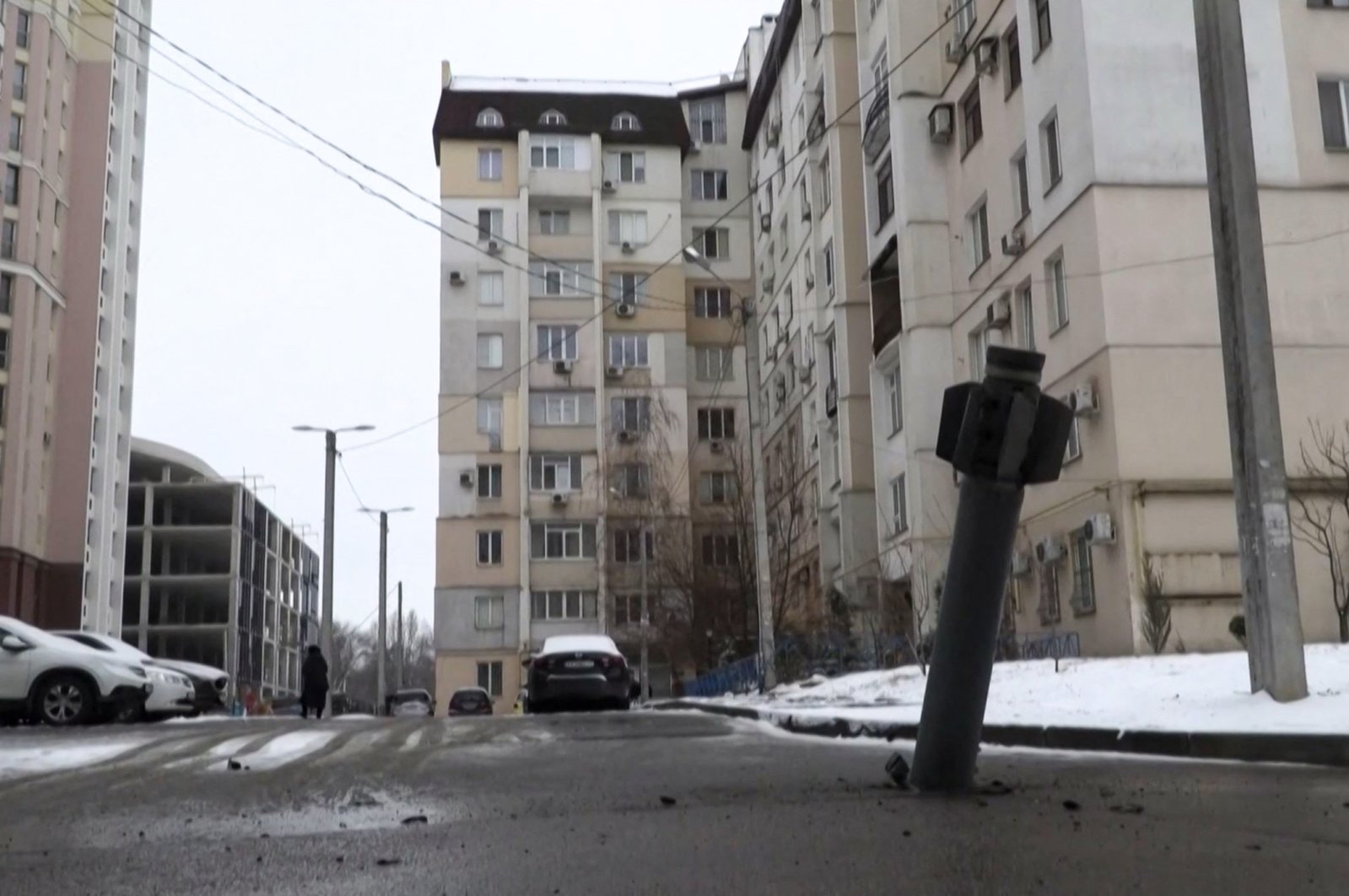 This video grab taken from a RFE/RL footage shows the tail section of a missile that hit a residential area of the city of Kharkiv, Ukraine, Feb. 25, 2022. (Photo by Radio Free Europe/Radio Liberty/AFP)