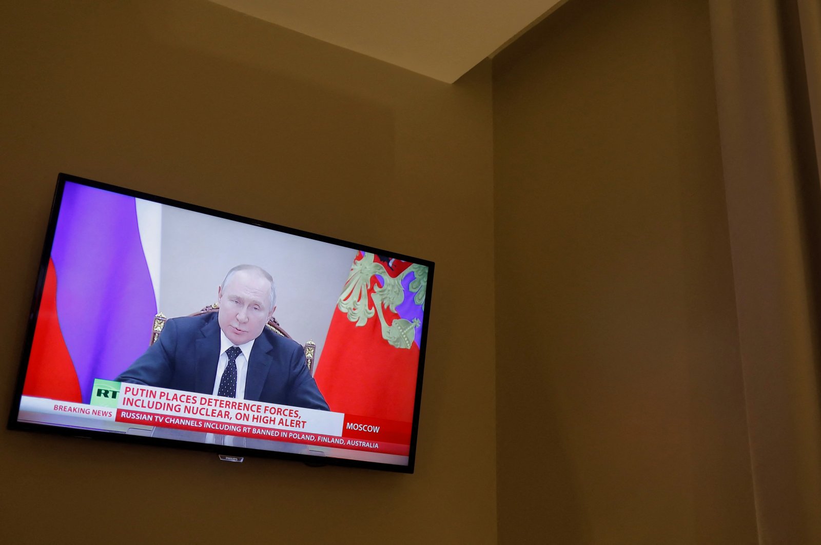 Russian President Vladimir Putin is seen on a TV screen in a hotel during a live news broadcast of the Russia Today (RT) channel TV, after Russia launched a massive military operation against Ukraine, Madrid, Spain, Feb. 27, 2022. (Reuters Photo)