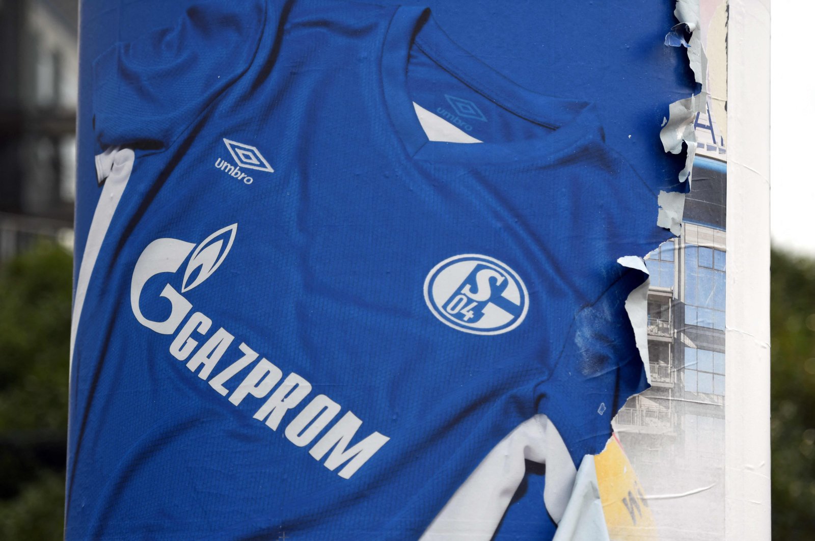 A poster shows a Schalke 04 shirt with the Gazprom logo, Gelsenkirchen, Germany, Feb. 25, 2022. (AFP Photo)