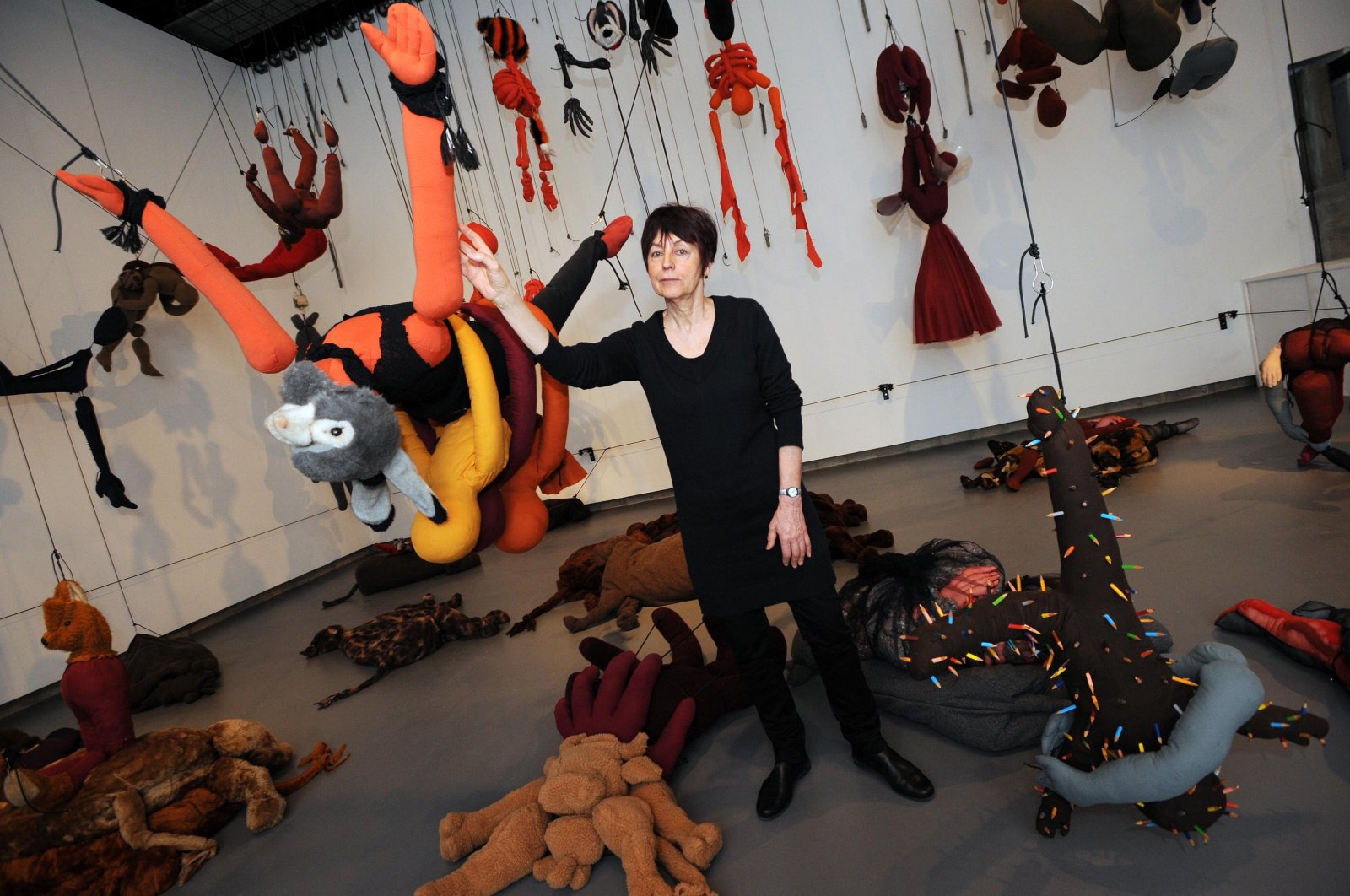 French artist Annette Messager with one of her fantastical installations, &quot;Articulated-Disarticulated 2001-2002.&quot; (Reuters Photo)
