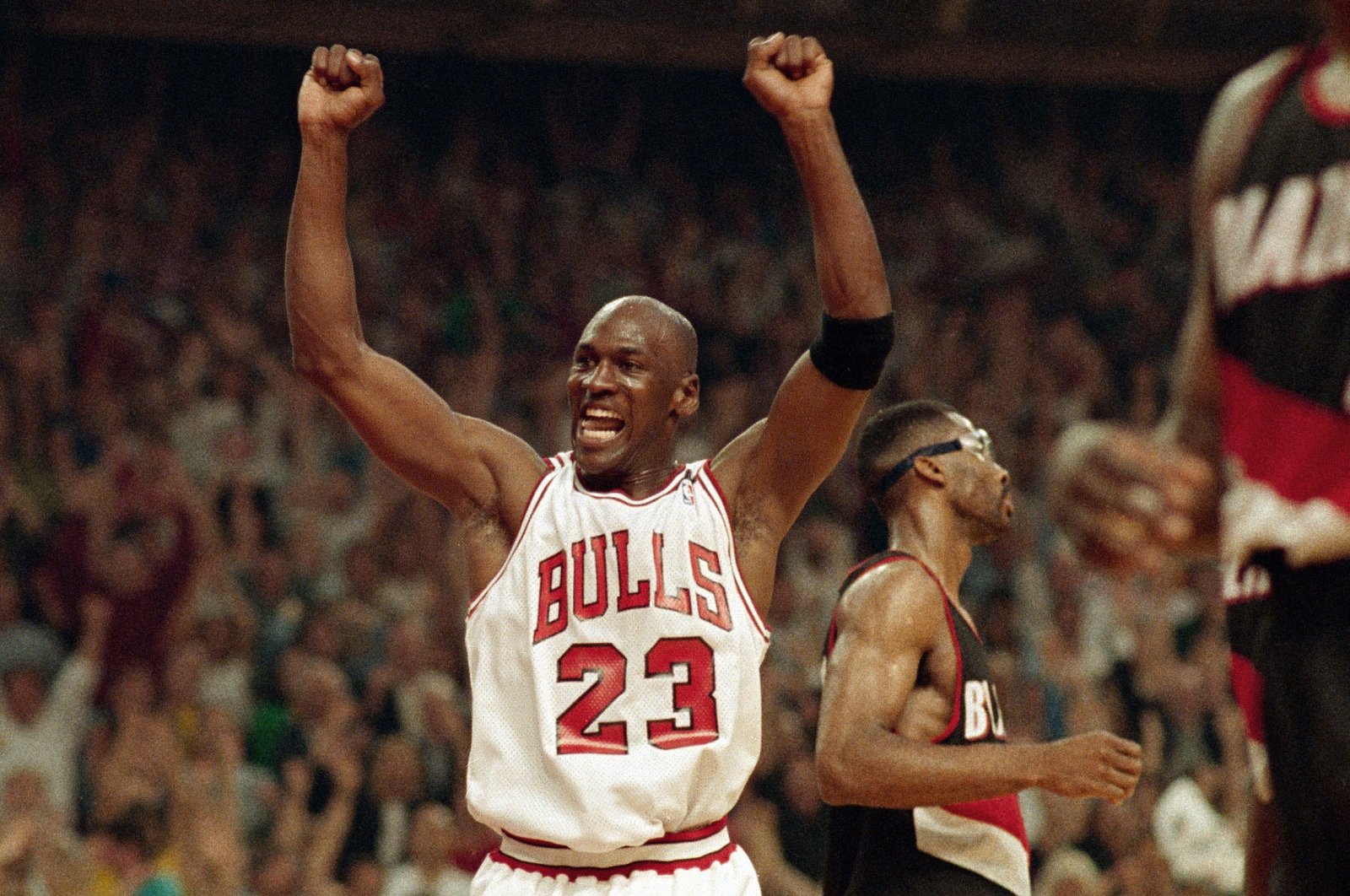 Michael Jordan celebrates the Bulls win over the Portland Trail Blazers in the NBA Finals in Chicago, U.S., June 14, 1992. (AP Photo)