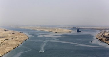 An army zodiac secures the entrance of a new section of the Suez Canal in Ismailia, Egypt, Aug. 6, 2015. (AP Photo)
