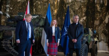 (L-R) British Prime Minister Boris Johnson, Prime Minister of Estonia Kaja Kallas and Secretary General of NATO Jens Stoltenberg pose on the sidelines a joint press conference at the Tapa Army Base on March 1, 2022 in Tallinn, Estonia. - British Prime Minister Boris Johnson said on a visit to Poland on March 1, that the West would keep up sanctions pressure on Russian President Vladimir Putin's regime indefinitely after it invaded Ukraine. (Photo by RAIGO PAJULA / AFP)