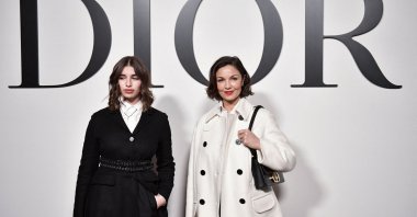 French actress Nadia Fares (R) and her daughter Shana Chasman pose for a photocall for the Christian Dior Fall-Winter 2022-2023 collection fashion show during the Paris Womenswear Fashion Week, in Paris, on March 1, 2022. (AFP Photo)
