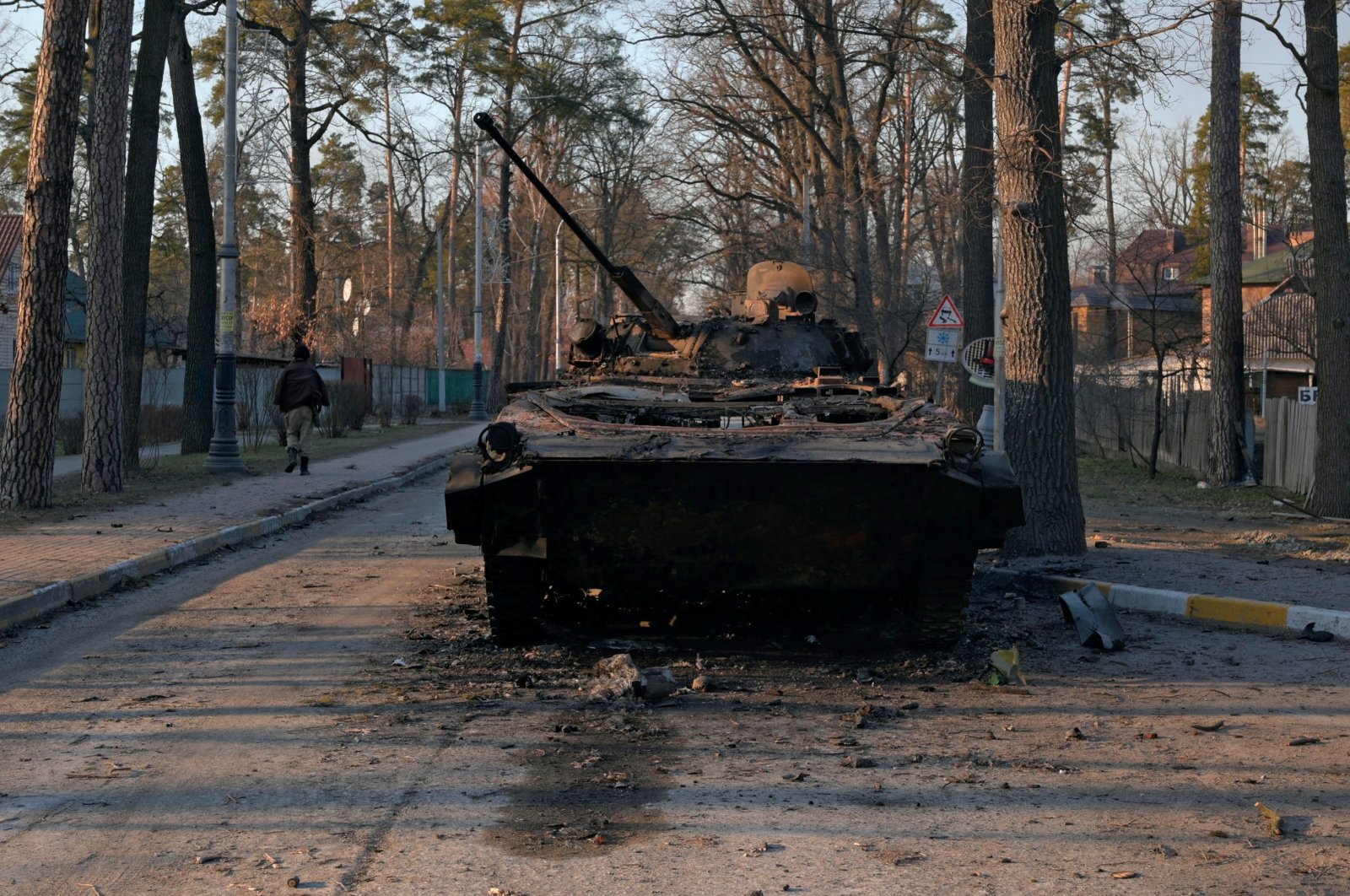 A charred armoured vehicle is seen on a street, as Russia&#039;s invasion of Ukraine continues, in the town of Bucha in the Kyiv region, Ukraine, Feb. 28, 2022. (Reuters Photo)