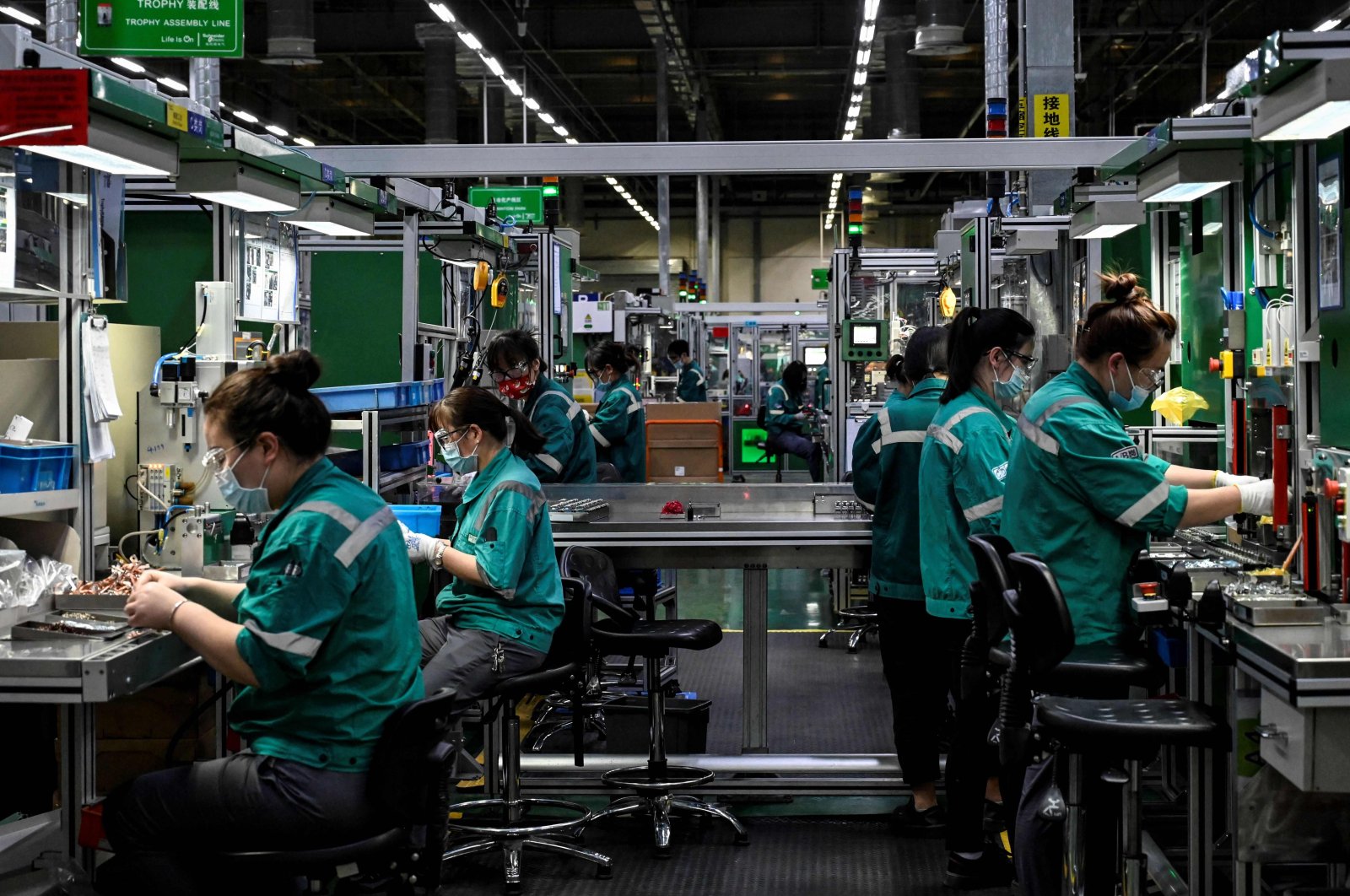 Employees work on a production line at a factory in Beijing, China, Feb. 17, 2022. (AFP Photo)