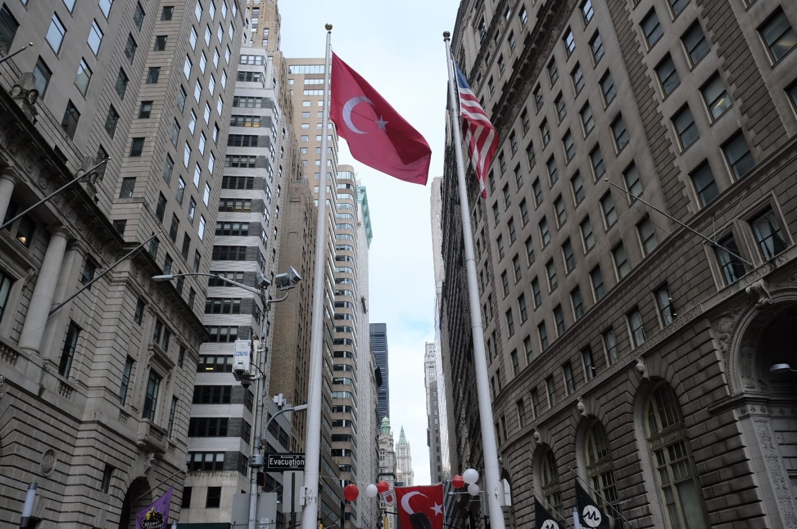 The Turkish and American flags fly in the Bowling Green Park area on Wall Street, New York, U.S., Oct. 31, 2021. (AA File Photo)