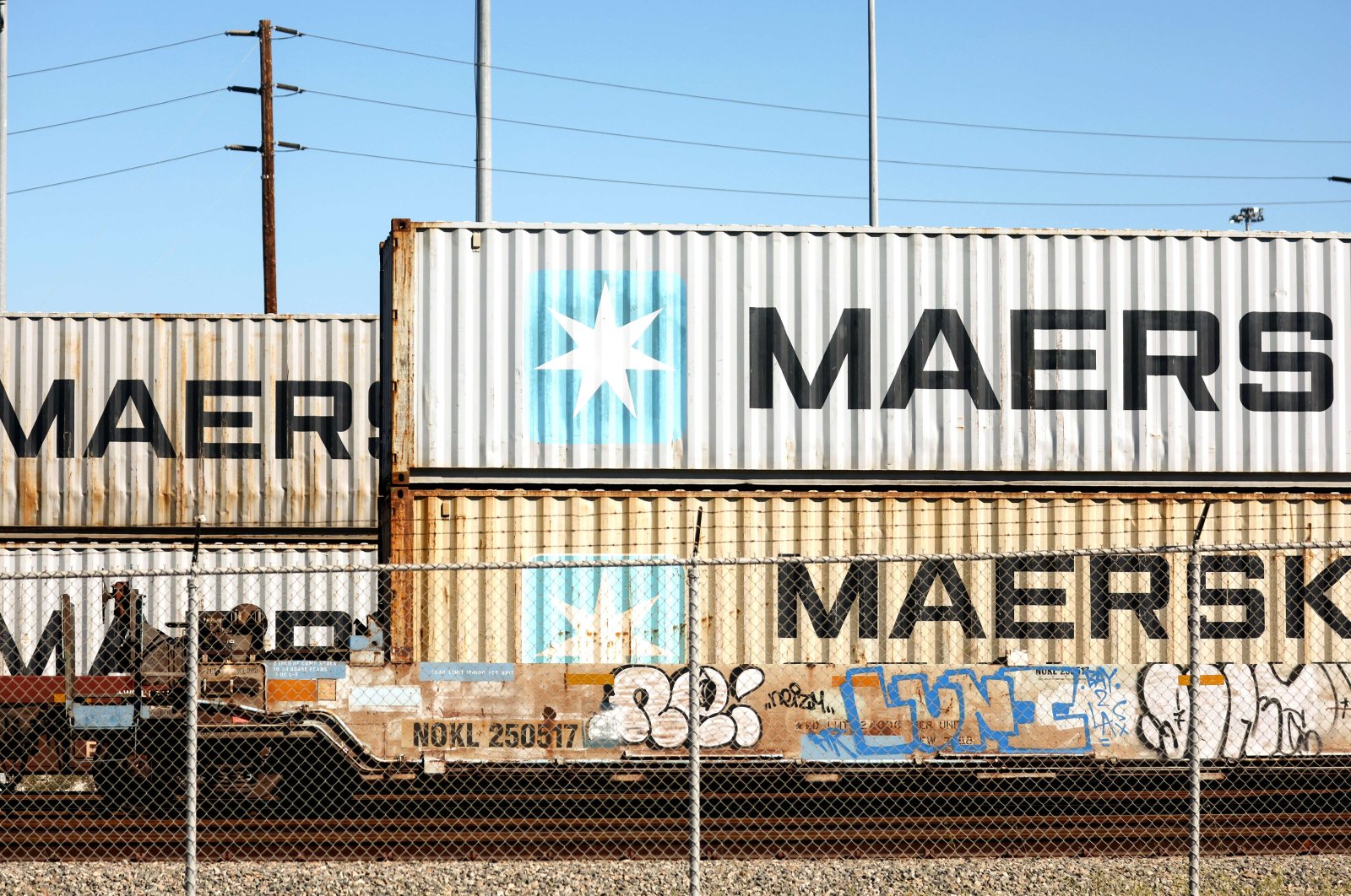 Maersk shipping containers sit on rail cars at the Port of Los Angeles, California, U.S., Feb. 9, 2022. (AFP Photo)