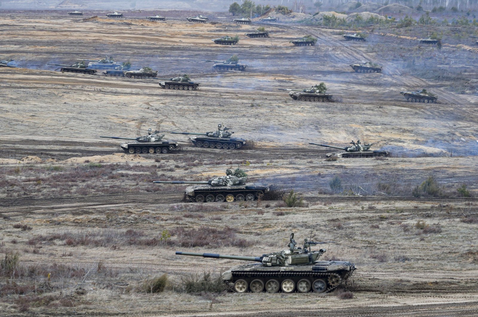 Tanks move during the Union Courage-2022 Russia-Belarus military drills at the Obuz-Lesnovsky training ground in Belarus, Feb. 19, 2022. (AP Photo)