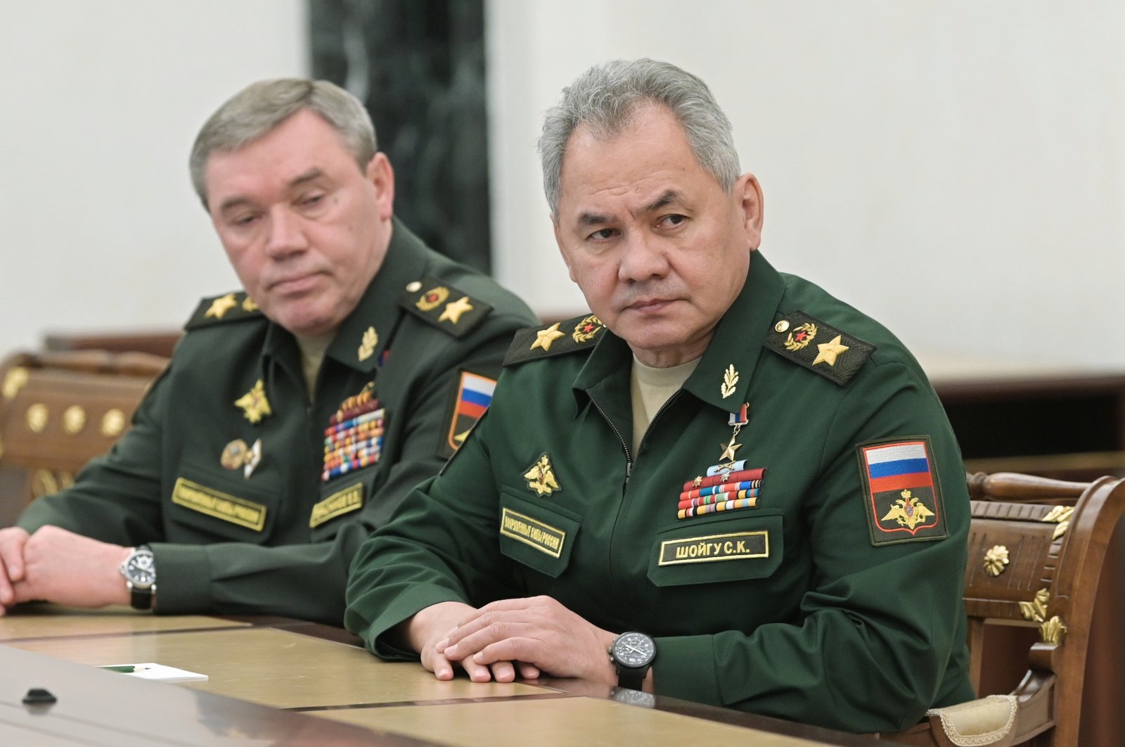 Russian Defense Minister Sergei Shoigu (R) and Head of the General Staff of the Armed Forces of Russia and First Deputy Defense Minister Valery Gerasimov listen to Russian President Vladimir Putin during their meeting in Moscow, Russia, Feb. 27, 2022. (AP Photo)