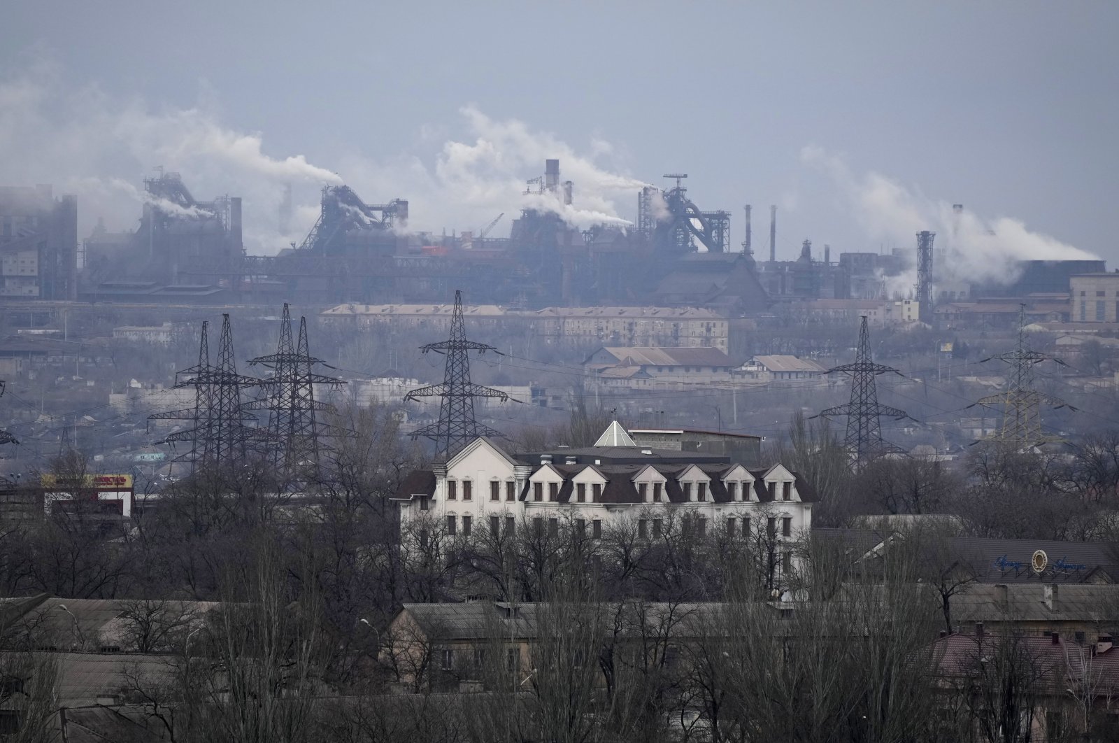 A metallurgical plant is seen on the outskirts of the city of Mariupol, Ukraine, Thursday, Feb. 24, 2022. (AP Photo)