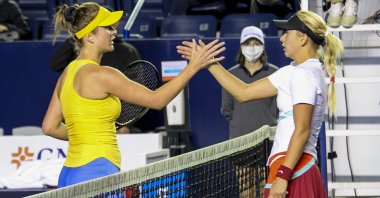 Ukraine's Elina Svitolina (L) and Russia's Anastasia Potapova shake hands after their match at the Abierto de Monterrey tennis tournament, Monterrey, Mexico, March 1, 2022. (AP Photo)