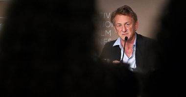 In this file photo, U.S. actor and director Sean Penn speaks during a press conference for the film &quot;Flag Day&quot; at the 74th edition of the Cannes Film Festival in Cannes, southern France, July 11, 2021. (AFP Photo)
