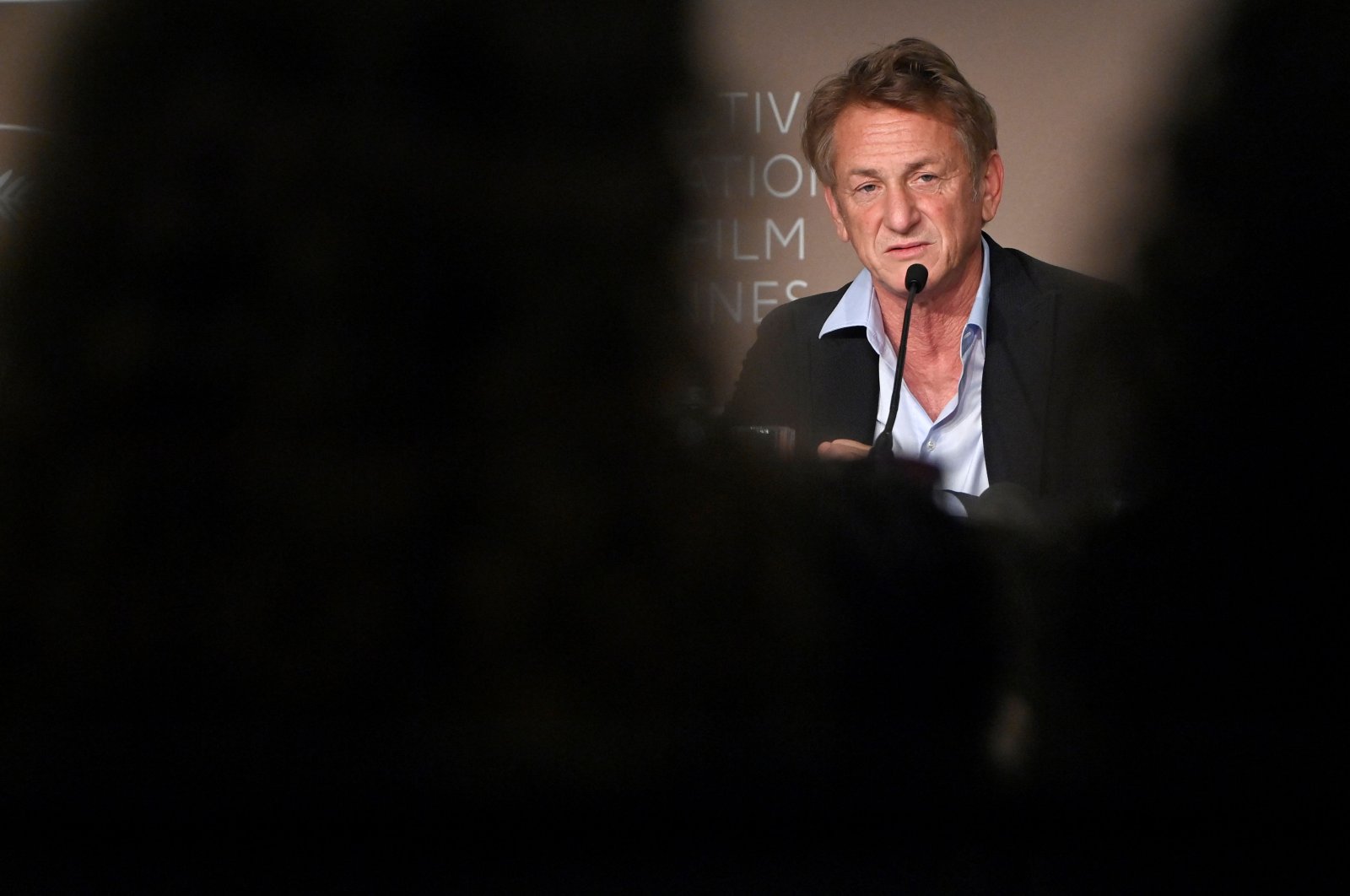 In this file photo, U.S. actor and director Sean Penn speaks during a press conference for the film &quot;Flag Day&quot; at the 74th edition of the Cannes Film Festival in Cannes, southern France, July 11, 2021. (AFP Photo)