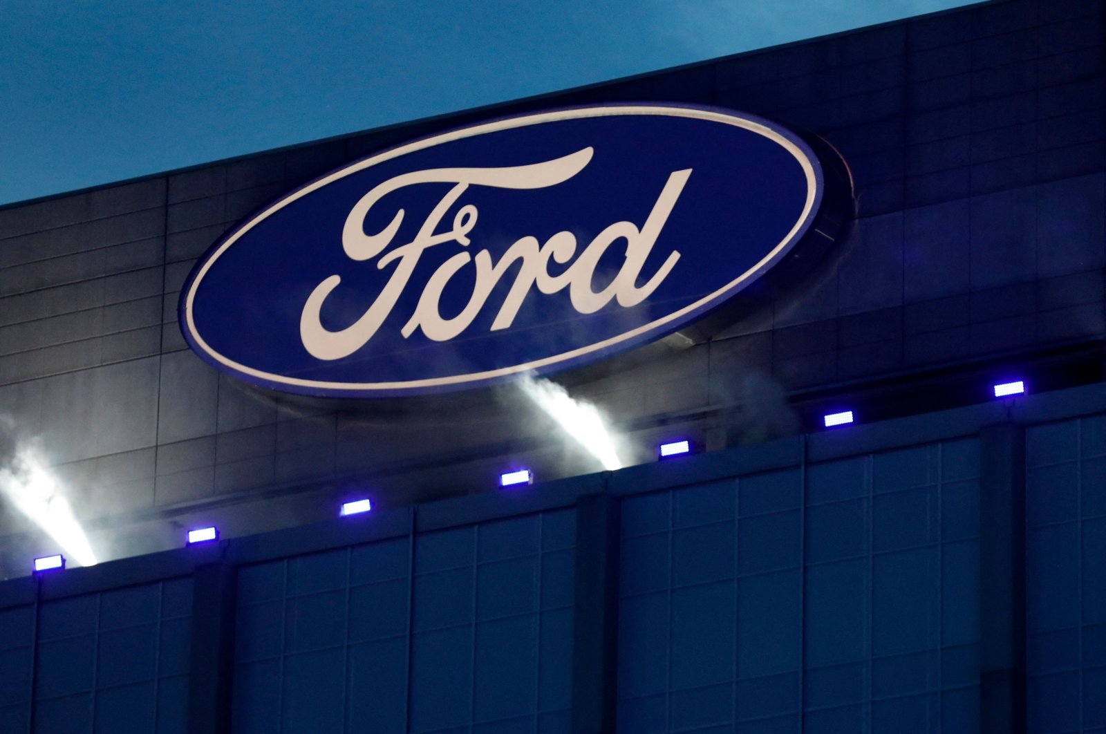 Ford&#039;s logo on the side of the building at the unveiling of their new electric F-150 Lightning outside of their headquarters in Dearborn, Michigan, U.S., May 19, 2021. (AFP Photo)