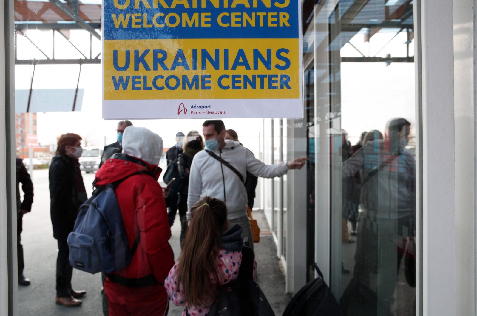 Ukrainian nationals fleeing the conflict in their country gather at a welcome center set up for them after their arrival at the Paris-Beauvais Airport in Tille, north of Paris, France, March 2, 2022. (AFP Photo)