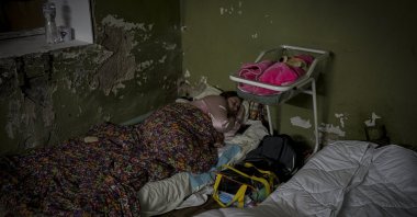 A woman sleeps next to her baby, Kyiv, Ukraine, March 2, 2022. (Uğur Yıldırım Photo)