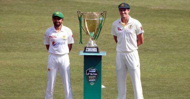 Pakistan's captain Babar Azam (L) and his Australian counterpart Pat Cummins (R) pose with the Test Series trophy, Rawalpindi, Pakistan, March 2, 2022. (EPA Photo)
