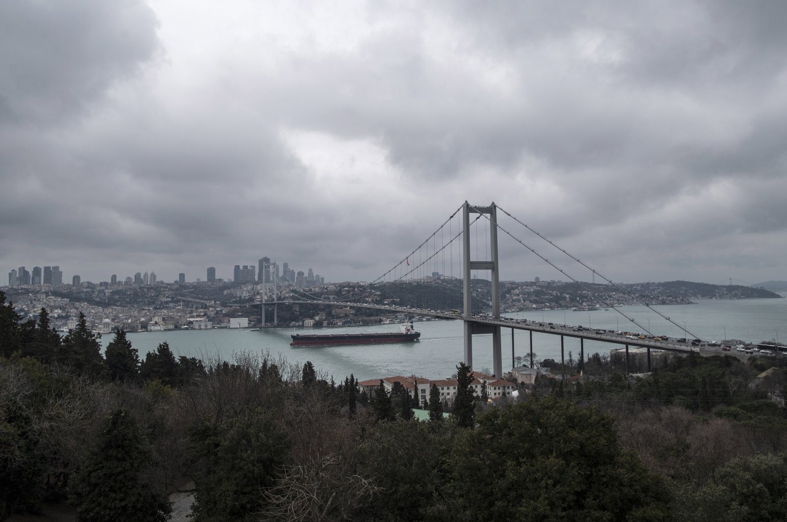 A cargo ship sails under the 15 July Martyrs Bridge on the Bosporus in Istanbul, Turkey, March 1, 2022. (EPA Photo)