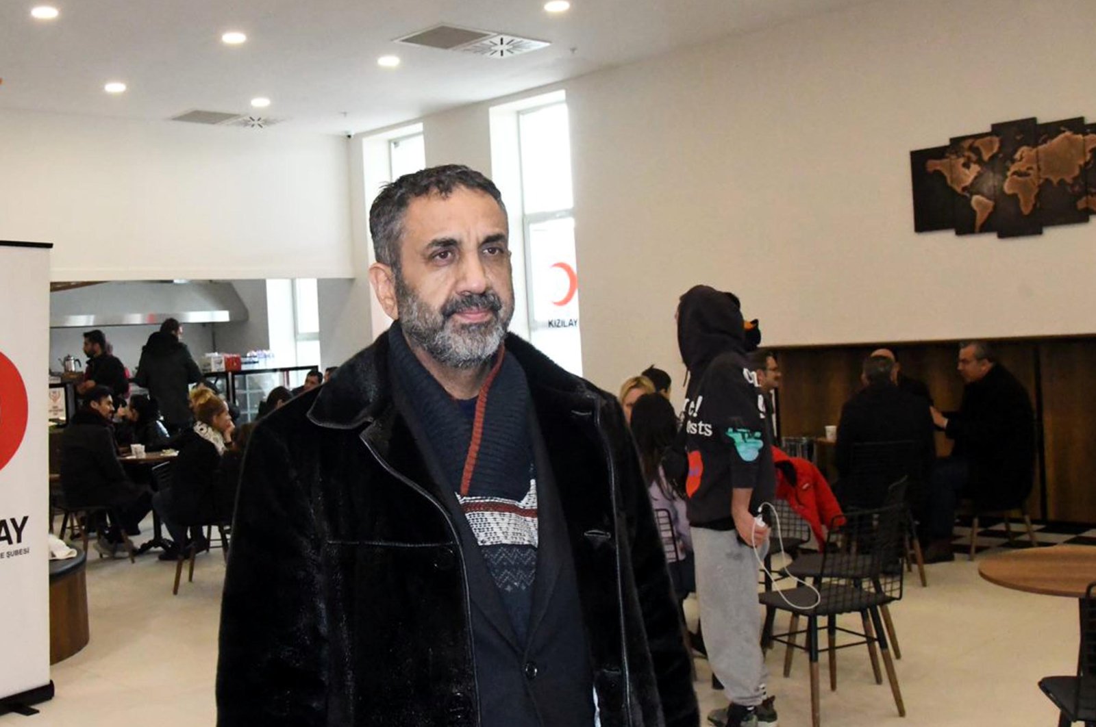 TIKA Ukraine coordinator Cüneyt Esmer speaks to reporters after arriving in Turkey, March 3, 2022. (DHA Photo)