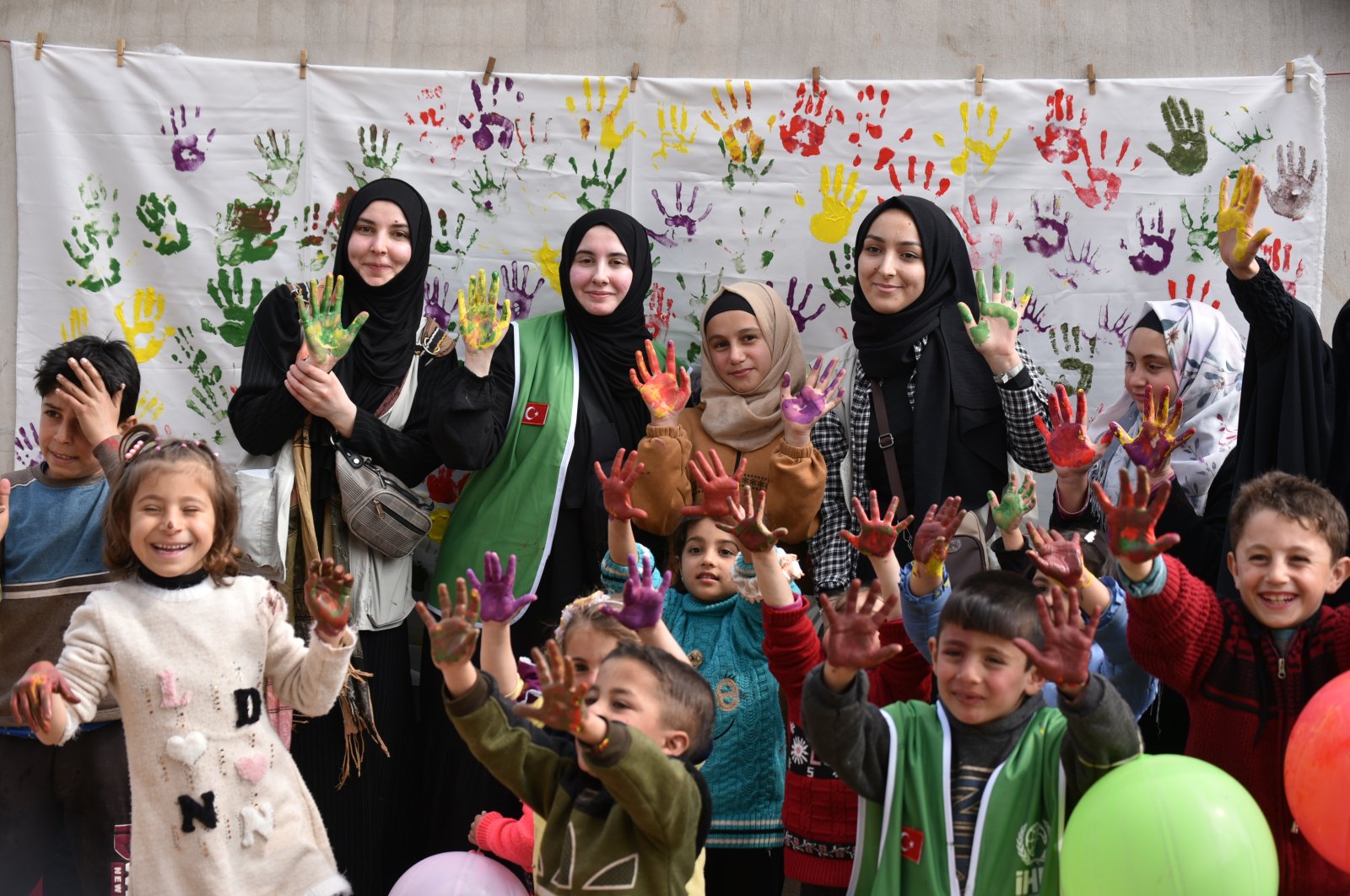 Children finger paint with supplies distributed by Turkish volunteers in Idlib, northwestern Syria, March 3, 2022. (AA Photo)