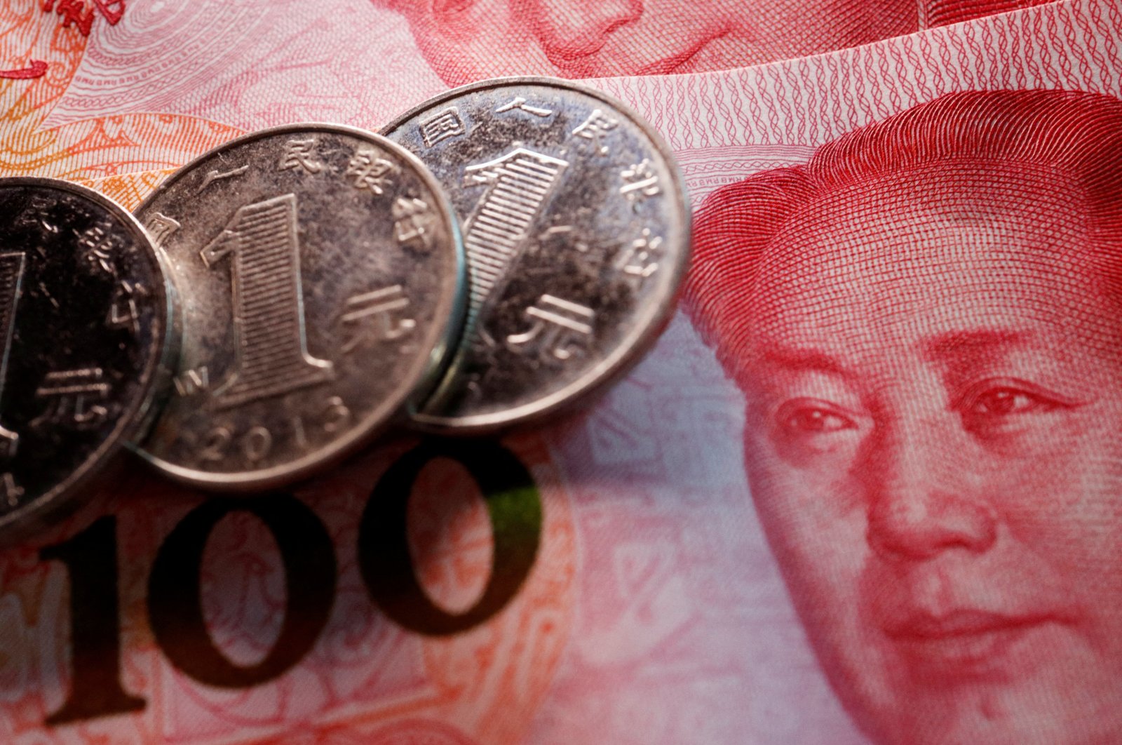 Coins and banknotes of China's yuan are seen in this illustration picture taken on Feb. 24, 2022. (Reuters Photo)