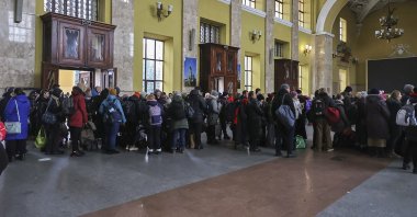 People wait for an evacuation train at a railway station in Kharkiv, Ukraine, March 3, 2022. (EPA Photo)