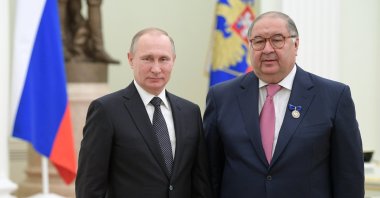 Russian President Vladimir Putin (L), poses for a photo with USM Holdings founder, businessperson Alisher Usmanov during an awarding ceremony in Moscow's Kremlin, Russia, Jan. 26, 2017. (AP Photo)