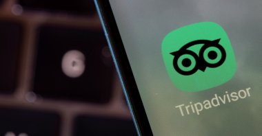 The Tripadvisor app is seen on a smartphone in this illustration taken Feb. 27, 2022. (Reuters Photo)