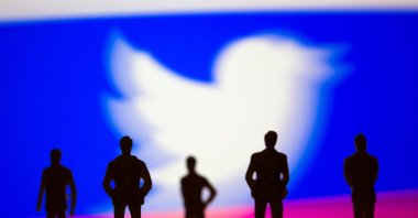 Small toy figures are seen in front of Twitter logo in this illustration picture taken March 15, 2021. (Reuters Photo)