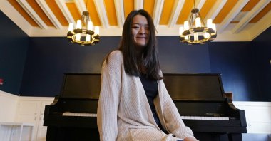 Julia Riew poses at Farkus Hall, on the campus of Harvard University in Cambridge, Mass., Wednesday, Feb. 16, 2022. (AP)