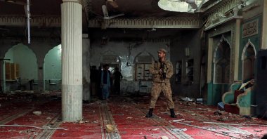 An army soldier stands amid the damages at the prayer hall after a bomb blast inside a mosque during Friday prayers in Peshawar, Pakistan, March 4, 2022. (REUTERS Photo)